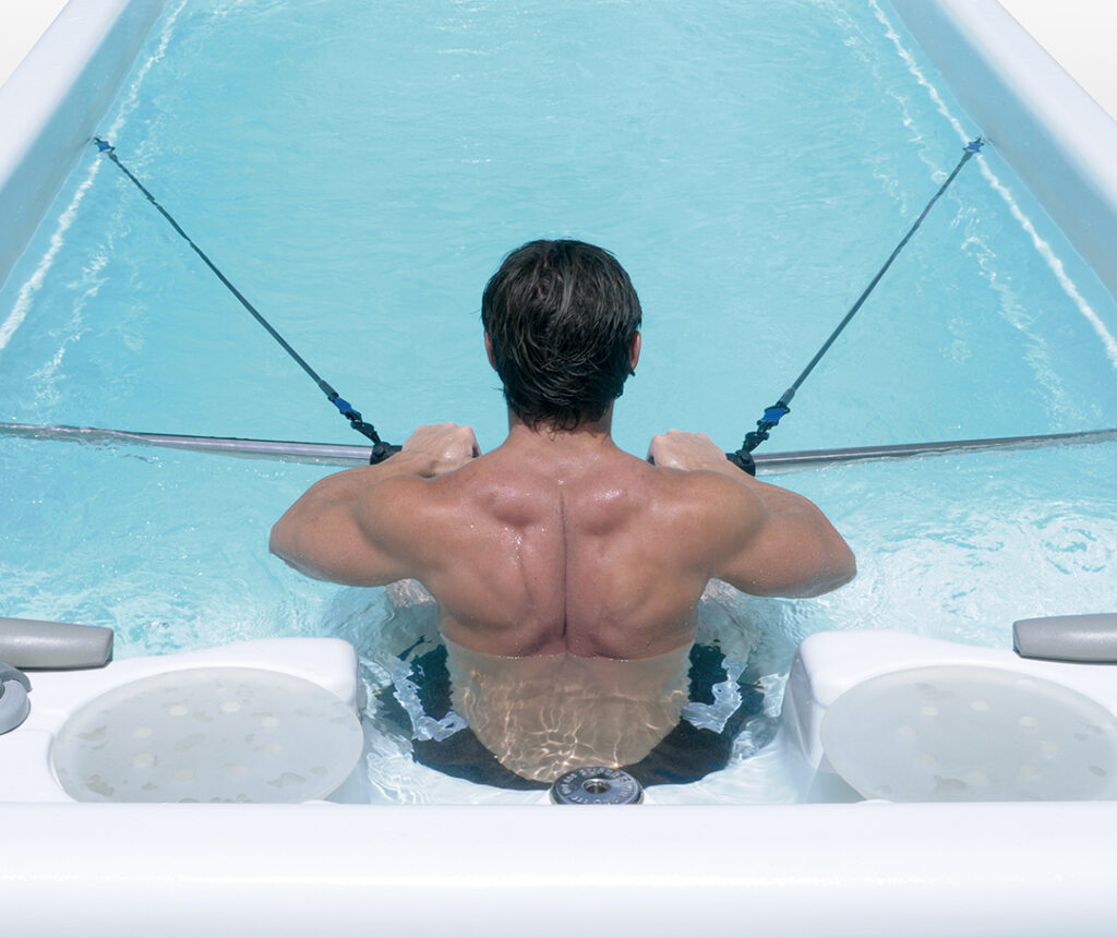 modern backyard swim spa with accessories and enclosure